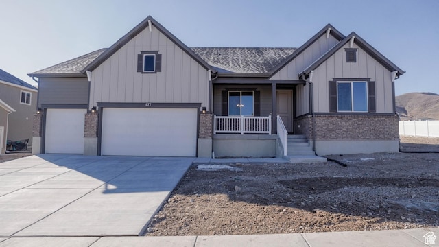 877 W Sika Cir S Unit 203, Saratoga Springs, UT 84045 - modern farmhouse featuring board and batten siding, covered porch, concrete driveway, and brick siding