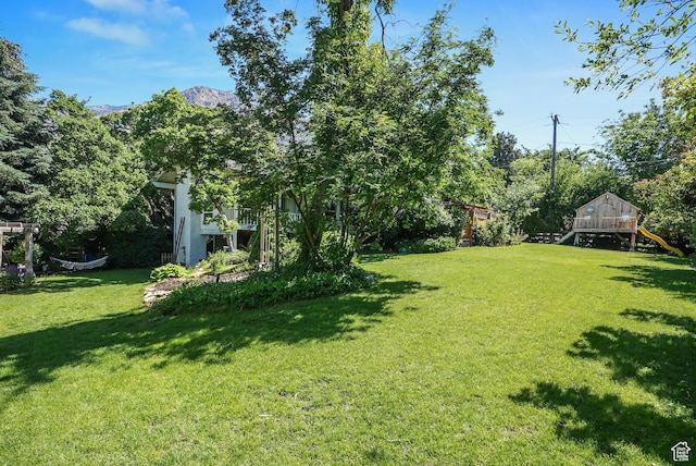 153 W 4350 N, Pleasant View, UT 84414 - view of grassy yard with a playground and a mountain view