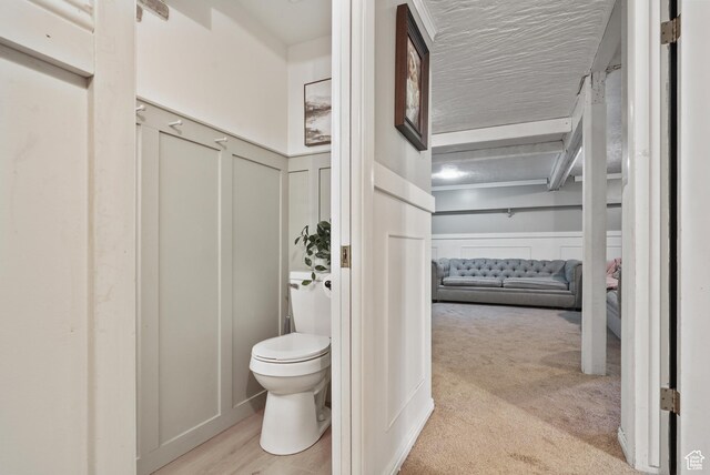 153 W 4350 N, Pleasant View, UT 84414 - bathroom with a decorative wall, toilet, and wainscoting