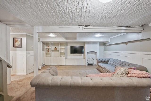 153 W 4350 N, Pleasant View, UT 84414 - living area with wainscoting, a decorative wall, and a textured ceiling