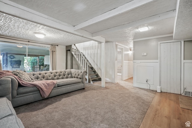 153 W 4350 N, Pleasant View, UT 84414 - living room with stairway, wainscoting, a textured ceiling, and a decorative wall