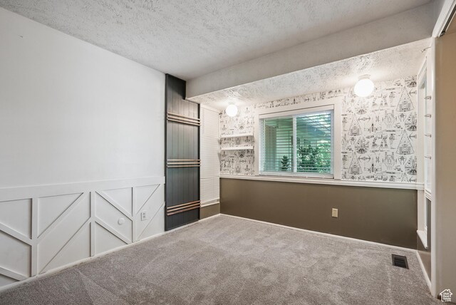 153 W 4350 N, Pleasant View, UT 84414 - carpeted spare room with a textured ceiling and a wainscoted wall