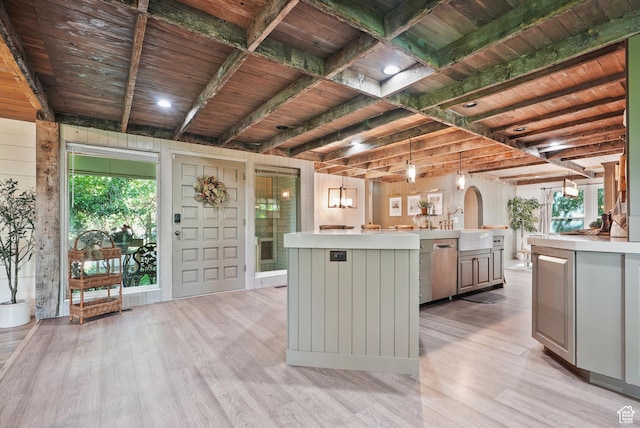 153 W 4350 N, Pleasant View, UT 84414 - kitchen featuring light countertops, light wood-style flooring, a kitchen island with sink, and wooden ceiling with exposed beams