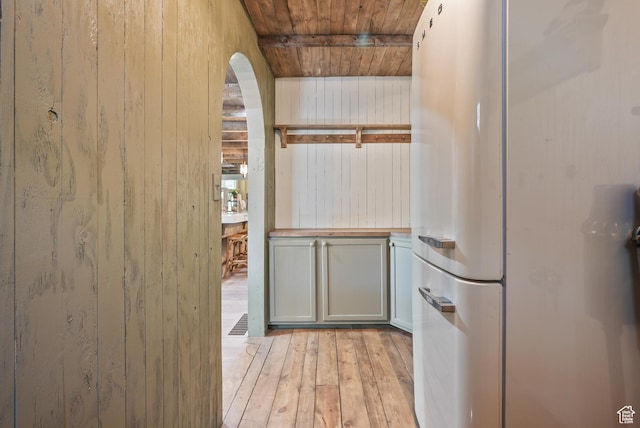 153 W 4350 N, Pleasant View, UT 84414 - doorway featuring arched walkways, wooden ceiling, wooden walls, and light wood-style flooring