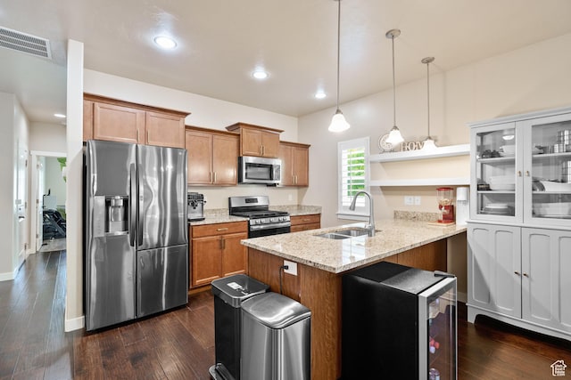 12568 S Bridal Veil Dr W, Riverton, UT 84065 - kitchen featuring stainless steel appliances, a sink, a peninsula, brown cabinets, and recessed lighting