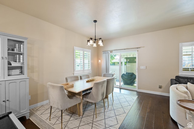 12568 S Bridal Veil Dr W, Riverton, UT 84065 - dining space featuring a chandelier, hardwood / wood-style flooring, and baseboards