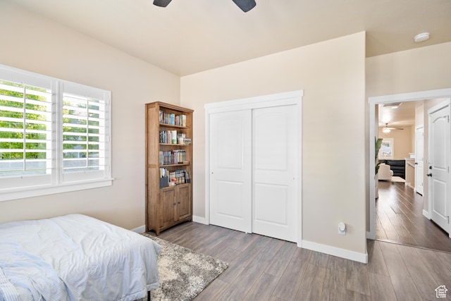 12568 S Bridal Veil Dr W, Riverton, UT 84065 - bedroom featuring baseboards, wood finished floors, a closet, and a ceiling fan