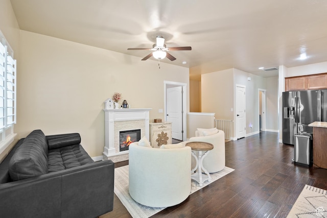 12568 S Bridal Veil Dr W, Riverton, UT 84065 - living room with a ceiling fan, dark wood-style floors, a stone fireplace, baseboards, and recessed lighting