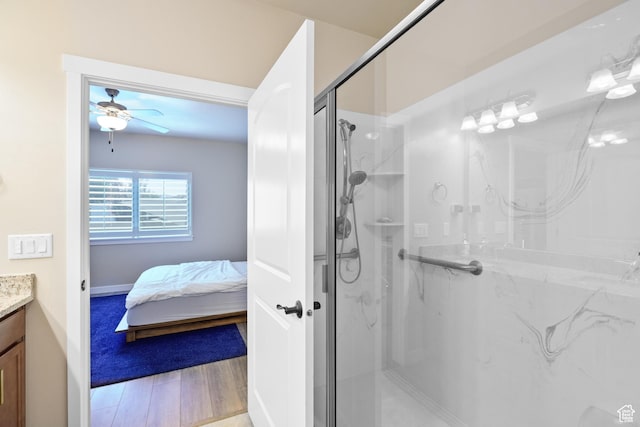 12568 S Bridal Veil Dr W, Riverton, UT 84065 - bathroom featuring vanity, ceiling fan, a marble finish shower, and wood finished floors