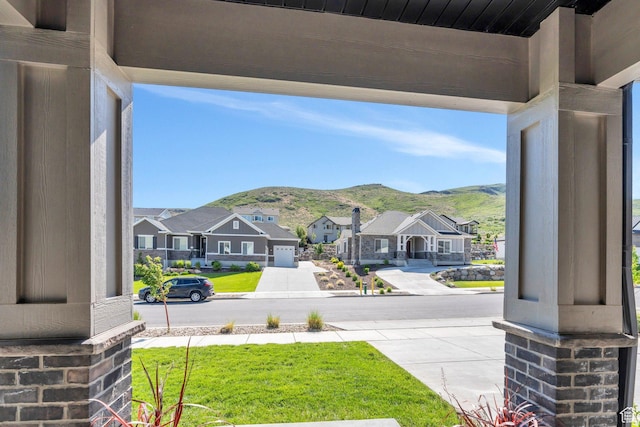 15058 S Spring Canyon Dr, Herriman, UT 84096 - view of yard with a residential view, covered porch, and a mountain view