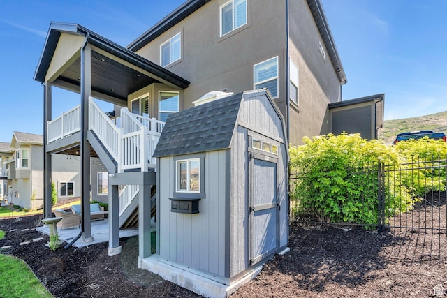 15058 S Spring Canyon Dr, Herriman, UT 84096 - back of house featuring stairs, a patio, and a shingled roof