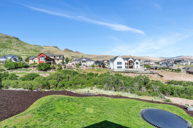 15058 S Spring Canyon Dr, Herriman, UT 84096 - view of green lawn with a mountain view and a residential view