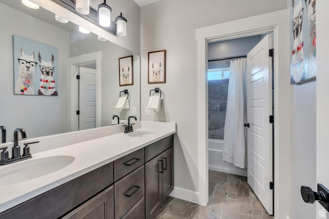 15058 S Spring Canyon Dr, Herriman, UT 84096 - full bathroom featuring marble look tile flooring, double vanity, baseboards, and shower / bathtub combination with curtain