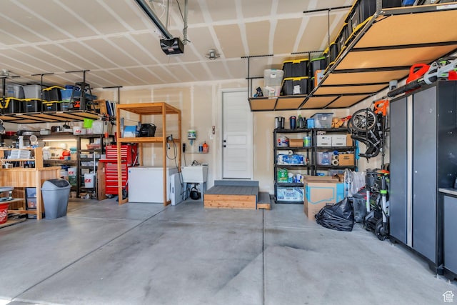 15058 S Spring Canyon Dr, Herriman, UT 84096 - garage with a garage door opener and a sink