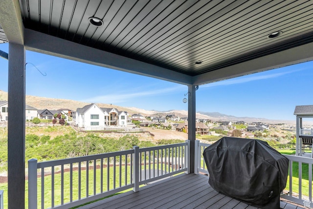 15058 S Spring Canyon Dr, Herriman, UT 84096 - wooden terrace featuring a residential view, a grill, a mountain view, and a lawn