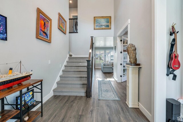 15058 S Spring Canyon Dr, Herriman, UT 84096 - staircase with wood finished floors and baseboards