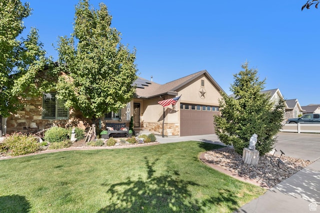 3547 E Jacobs Way, Eagle Mountain, UT 84005 - view of property hidden behind natural elements featuring a front yard, stone siding, solar panels, a garage, and concrete driveway
