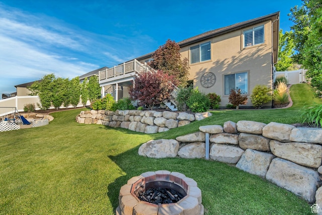 3547 E Jacobs Way, Eagle Mountain, UT 84005 - rear view of house featuring a fire pit and stucco siding