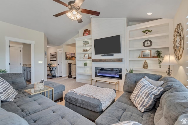 3547 E Jacobs Way, Eagle Mountain, UT 84005 - living room with a ceiling fan, light carpet, vaulted ceiling, a glass covered fireplace, and built in shelves