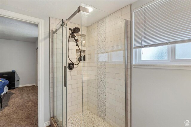 1602 E 2550 N, Layton, UT 84040 - bathroom with a shower stall, baseboards, and connected bathroom
