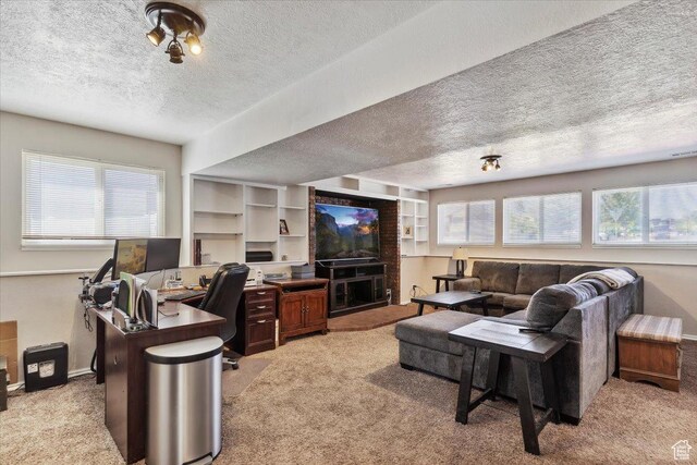 1602 E 2550 N, Layton, UT 84040 - living room featuring light carpet, a textured ceiling, healthy amount of natural light, and a desk