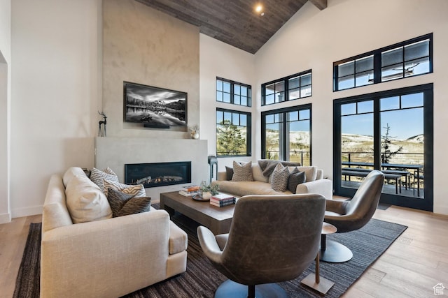 8200 E Royal St Unit 50, Deer Valley, UT 84060 - living room featuring high vaulted ceiling, a high end fireplace, wood finished floors, baseboards, and wood ceiling