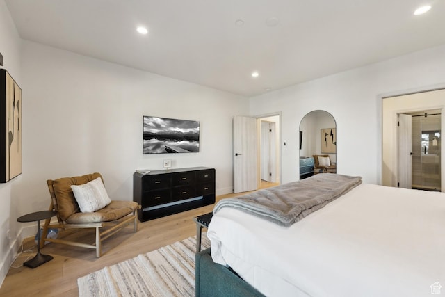 8200 E Royal St Unit 50, Deer Valley, UT 84060 - bedroom featuring arched walkways, light wood-style flooring, recessed lighting, and baseboards
