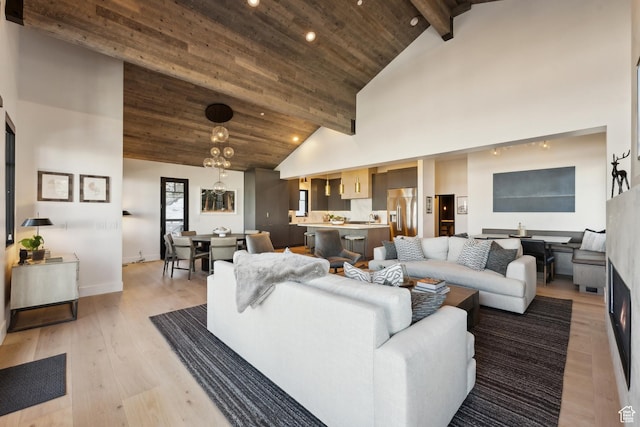 8200 E Royal St Unit 50, Deer Valley, UT 84060 - living room with high vaulted ceiling, recessed lighting, light wood-style flooring, wooden ceiling with exposed beams, and baseboards