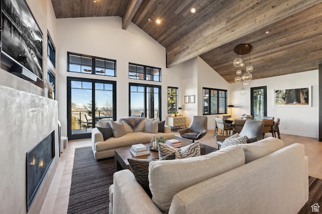 8200 E Royal St Unit 50, Deer Valley, UT 84060 - living room featuring wooden ceiling with exposed beams, a glass covered fireplace, high vaulted ceiling, recessed lighting, and a chandelier