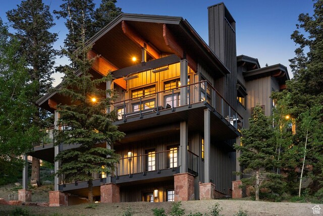 8200 E Royal St Unit 50, Deer Valley, UT 84060 - back of house with a balcony, a chimney, and board and batten siding