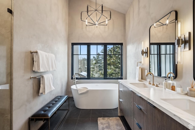 8200 E Royal St Unit 50, Deer Valley, UT 84060 - bathroom with a freestanding bath, high vaulted ceiling, double vanity, a chandelier, and tile patterned flooring