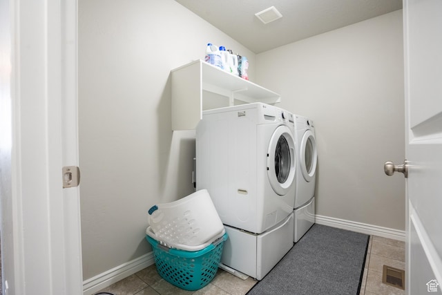 2534 S 2200 W, West Haven, UT 84401 - washroom featuring independent washer and dryer, light tile patterned flooring, and baseboards