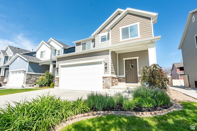 2534 S 2200 W, West Haven, UT 84401 - view of front of home with concrete driveway, an attached garage, and brick siding