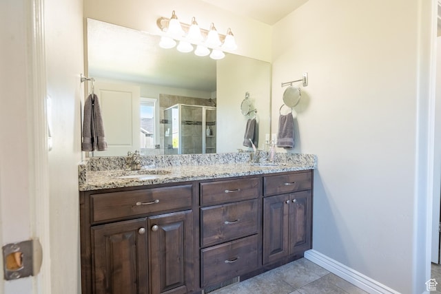 2534 S 2200 W, West Haven, UT 84401 - bathroom featuring double vanity, a shower stall, tile patterned flooring, and baseboards