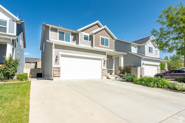 2534 S 2200 W, West Haven, UT 84401 - view of front of property with a garage, concrete driveway, and central AC unit