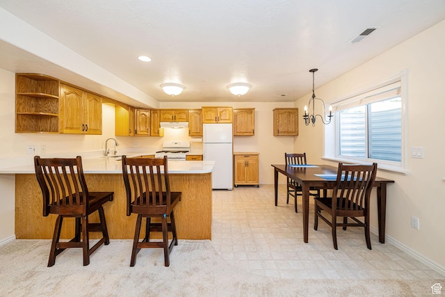 2678 E 25 S, Layton, UT 84040 - kitchen with white appliances, a peninsula, light countertops, open shelves, and brown cabinets