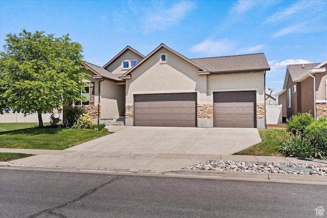 2432 Field Stone Way, Layton, UT 84041 - view of front of house featuring stone siding, an attached garage, and stucco siding