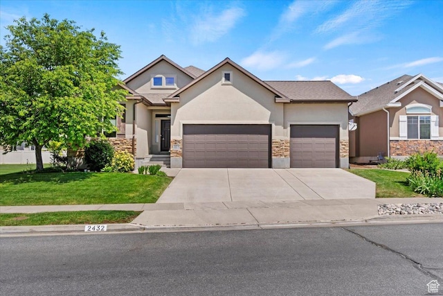 2432 Field Stone Way, Layton, UT 84041 - view of front facade featuring stucco siding, a garage, a front yard, concrete driveway, and stone siding