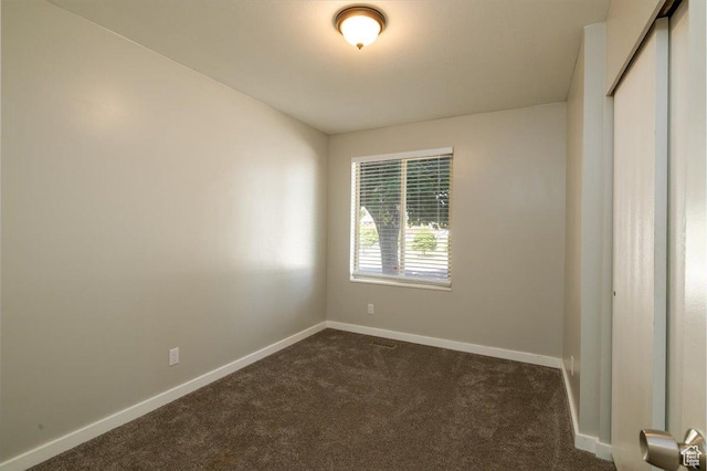 6837 S Baldwin Ave, West Jordan, UT 84084 - unfurnished room with dark colored carpet and baseboards