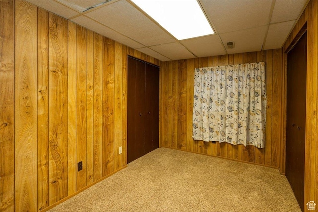 6837 S Baldwin Ave, West Jordan, UT 84084 - carpeted spare room featuring a drop ceiling and wood walls