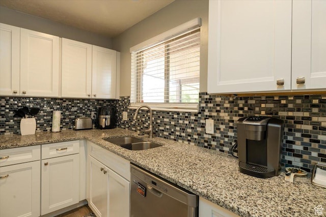 6837 S Baldwin Ave, West Jordan, UT 84084 - kitchen with stainless steel dishwasher, a sink, decorative backsplash, and white cabinets