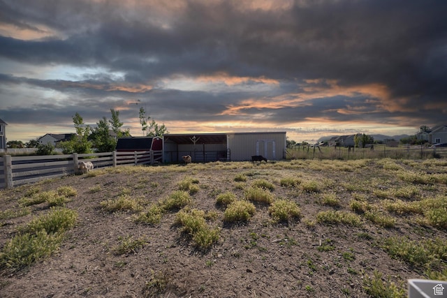 2609 W 3075 S, West Haven, UT 84401 - yard at dusk featuring an outbuilding and a pole building