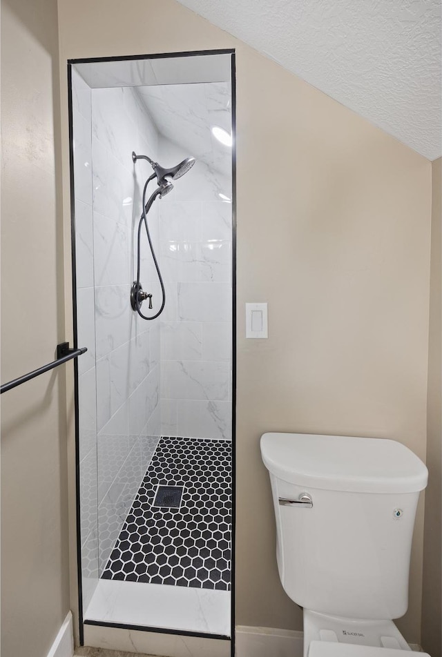 2609 W 3075 S, West Haven, UT 84401 - bathroom featuring a shower stall, toilet, and baseboards