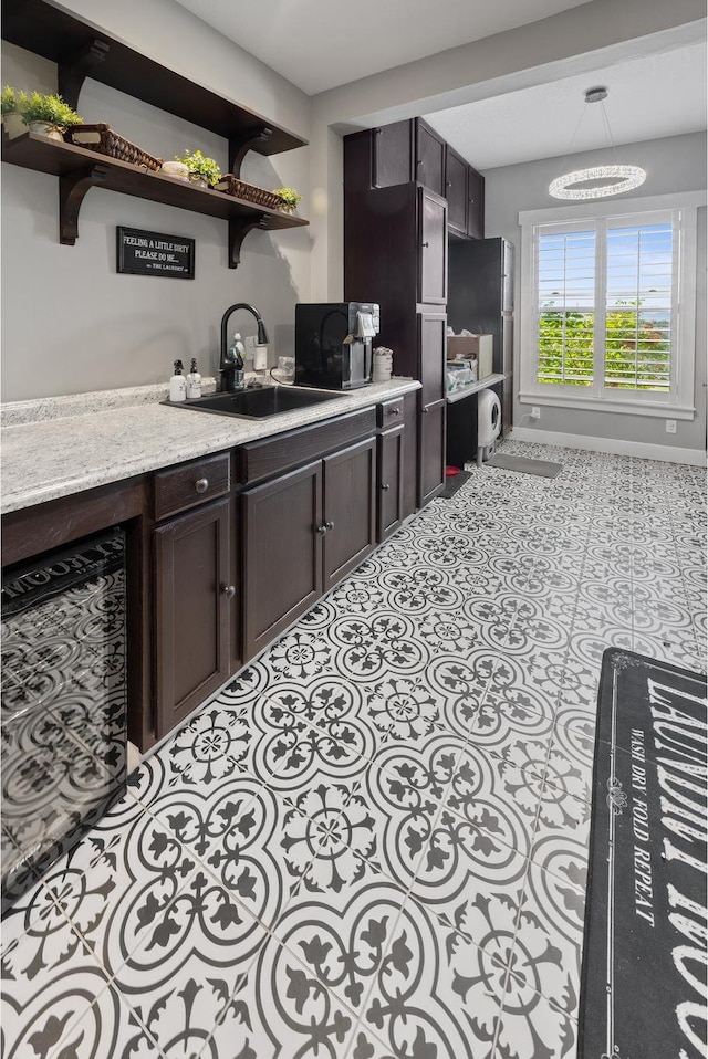 2609 W 3075 S, West Haven, UT 84401 - kitchen with a sink, open shelves, and dark brown cabinets