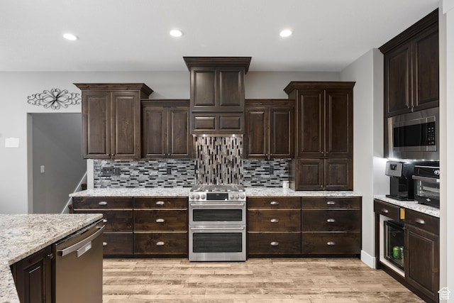 2609 W 3075 S, West Haven, UT 84401 - kitchen with stainless steel appliances, tasteful backsplash, light wood-style floors, and recessed lighting