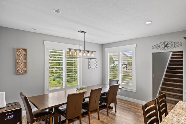 2609 W 3075 S, West Haven, UT 84401 - dining space with wood finished floors, stairs, baseboards, recessed lighting, and a chandelier