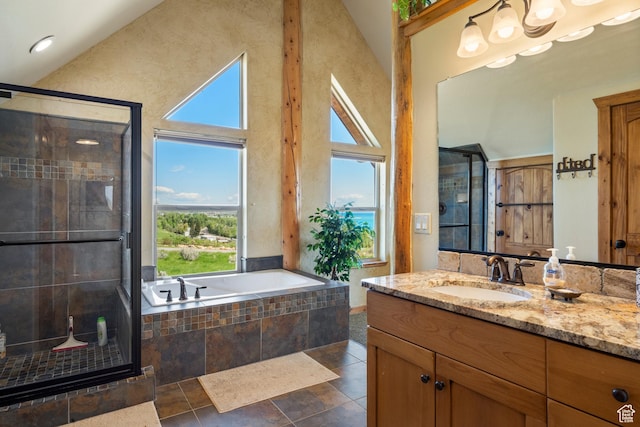 125 W Persimmon Dr Unit 2, Garden City, UT 84028 - bathroom featuring vanity, a stall shower, and a garden tub