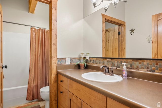 125 W Persimmon Dr Unit 2, Garden City, UT 84028 - bathroom with toilet, vanity, shower / bath combination with curtain, and tasteful backsplash