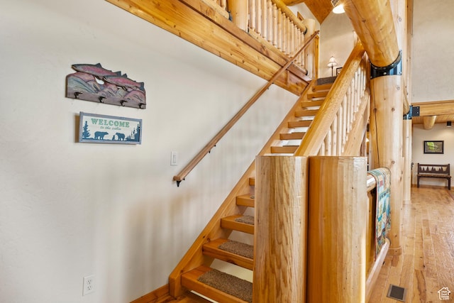 125 W Persimmon Dr Unit 2, Garden City, UT 84028 - stairway with wood-type flooring and a high ceiling