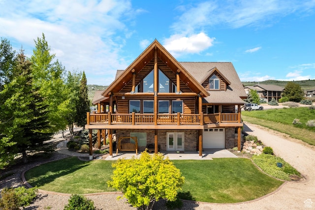 125 W Persimmon Dr Unit 2, Garden City, UT 84028 - back of house featuring french doors, stone siding, a yard, and a wooden deck